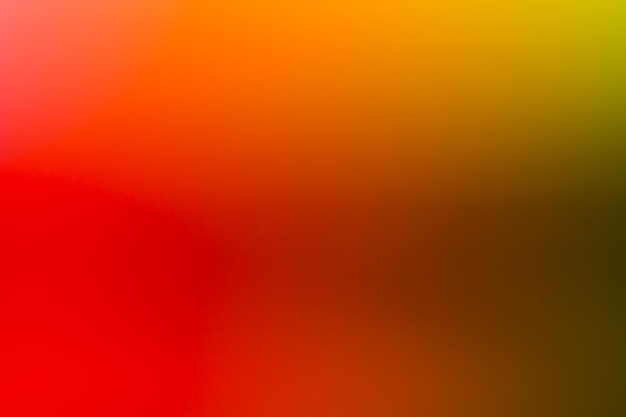 A yellow and orange background with a blurry background.