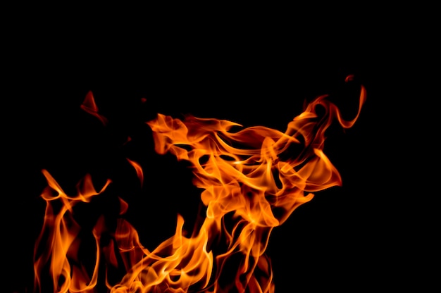 Photo yellow-orange flame on a black background