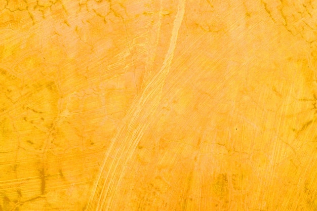 テクスチャと苦しめられたヴィンテージグランジイラストと黄色オレンジ色の壁の背景