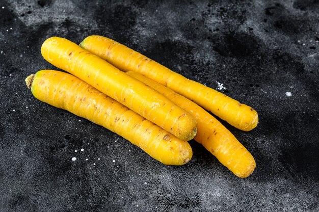 Yellow organic carrots without tops.