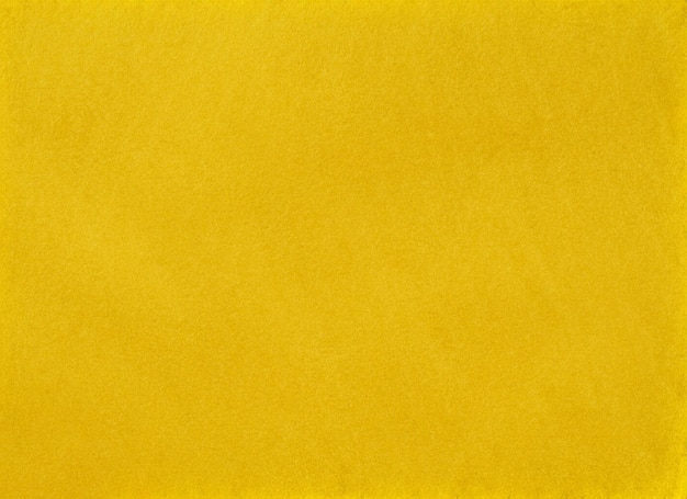 黄色の紙の背景またはテクスチャ