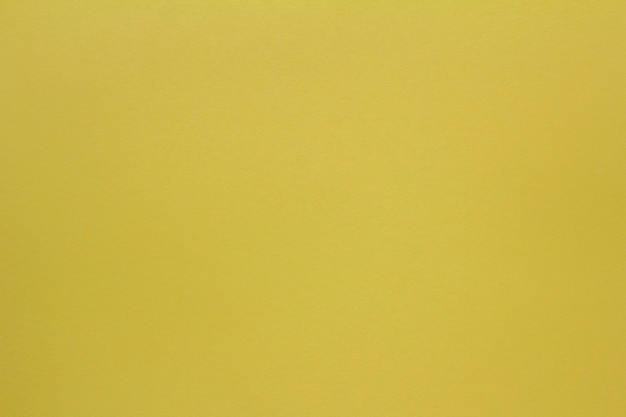 Yellow paper backgroundThe texture of thick yellow paper for creativitySpace for copying