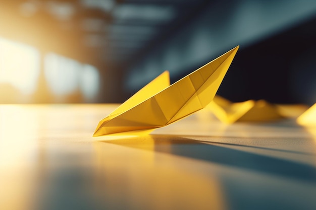 A yellow paper boat is on the floor in front of a dark background