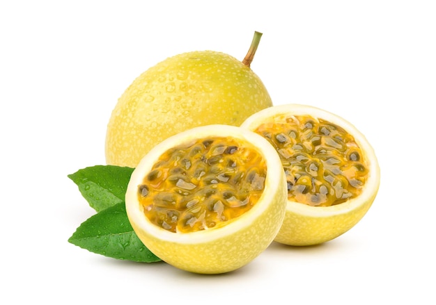 Photo yellow  passion fruit with cut in half and green leaf isolated on white background.