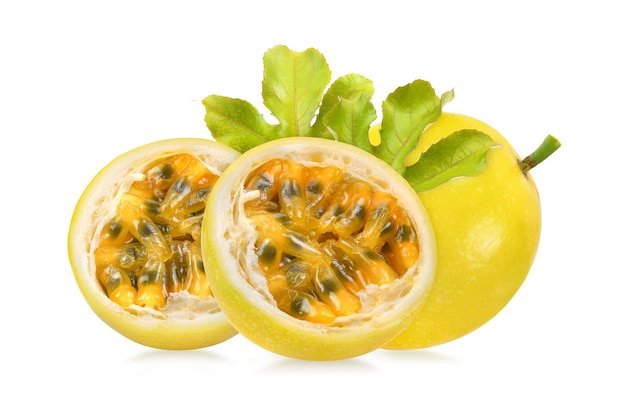 yellow passion fruit with leaf on white background