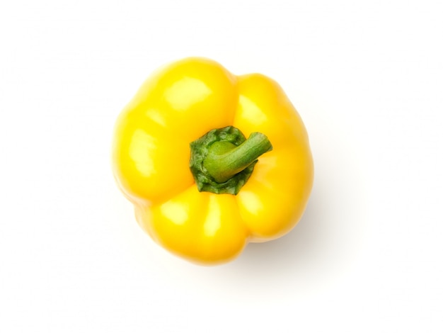 Yellow pepper on white surface