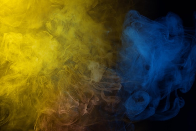 Yellow and pink steam on a black background