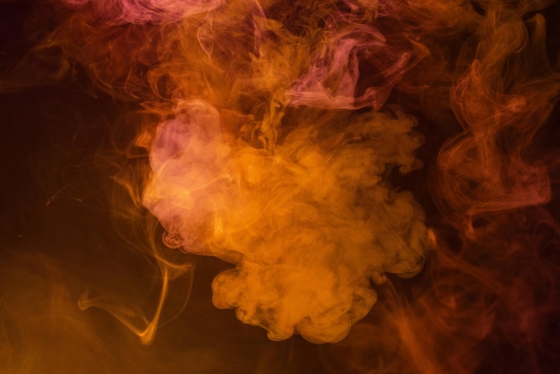 Yellow and pink steam on a black background