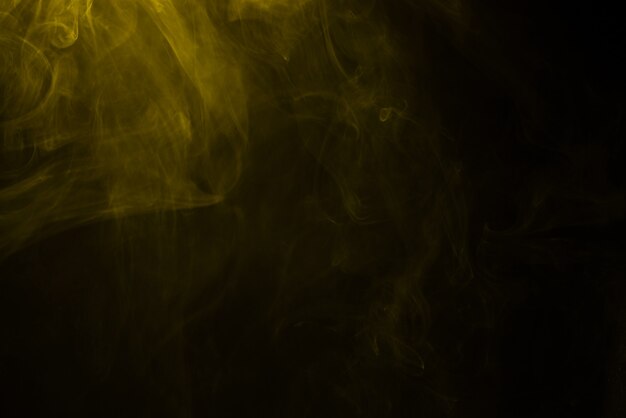 Yellow and pink steam on a black surface