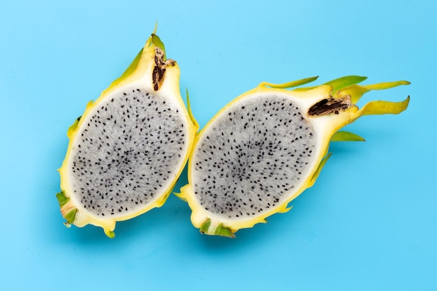 Yellow pitahaya on blue surface