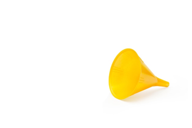 A yellow plastic funnel on a white background with copy space