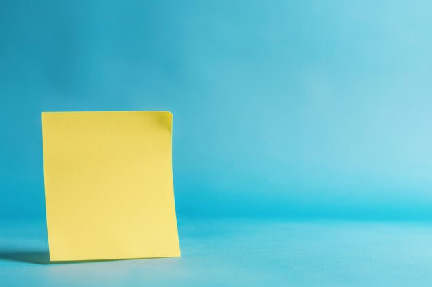 Yellow PostIt Note on Blue Surface