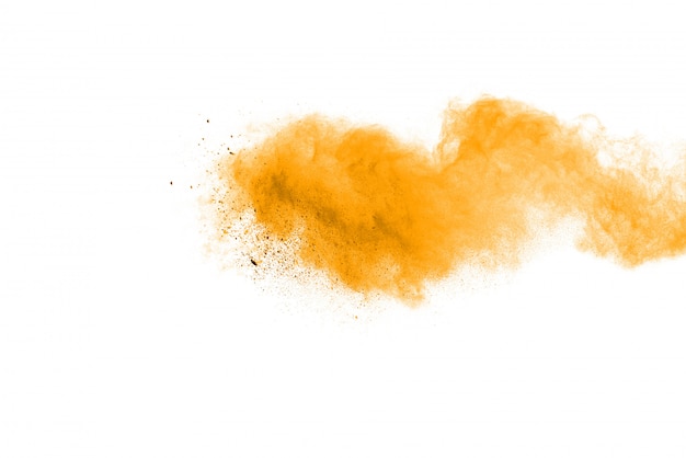 Yellow powder explosion isolated on black background