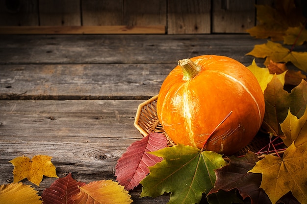 Yellow pumpkin on rustic wooden table