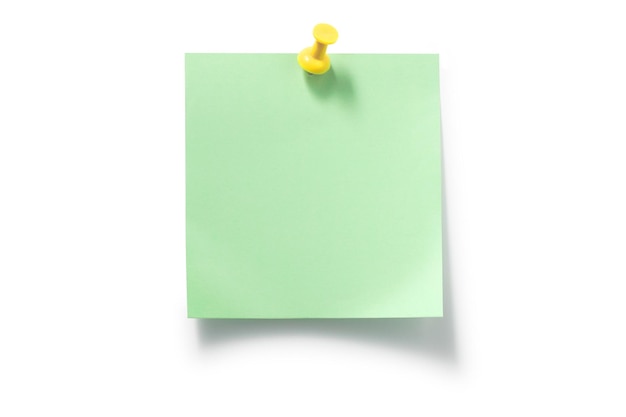 Yellow pushpin and green sticky notes