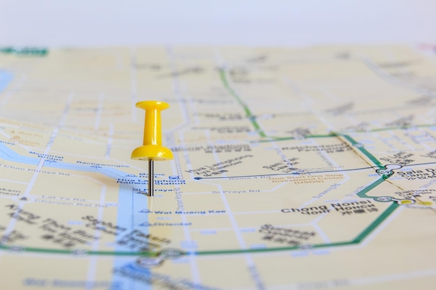 Yellow pushpin showing the location of a destination point on a map