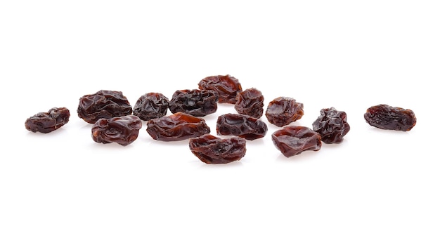 Yellow raisins on white background