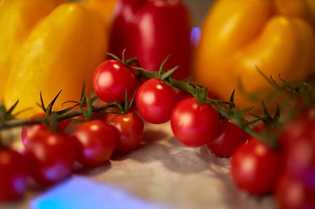 yellow and red peppers and cherry tomatoes closeup photo