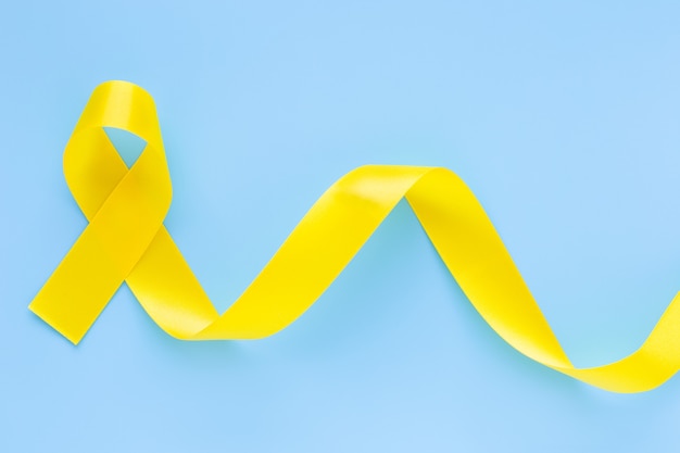 Yellow ribbon on light blue