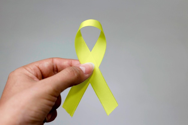 Nastro giallo mese di sensibilizzazione al cancro alle ossa di luglio giallo ed epatite virale