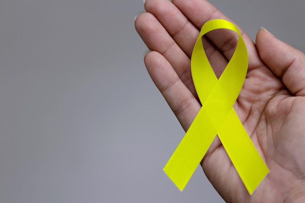 Yellow ribbon Yellow July Bone Cancer Awareness Month and Viral Hepatitis