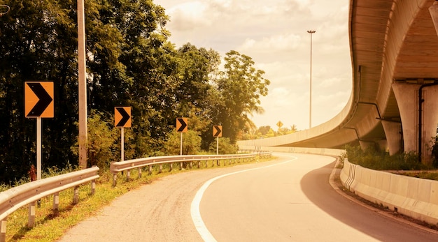 Yellow road sign on highway road