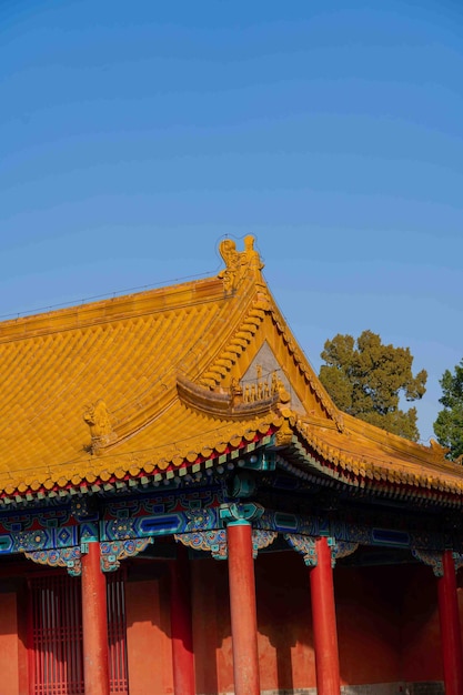 A yellow roof with a blue sky behind it