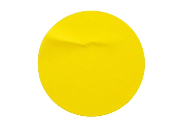 Фото Желтый круглый бумажный стикер этикетка, изолированные на белом фоне
