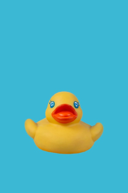 Yellow rubber duck for swimming on a blue background