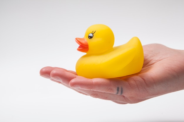 Yellow rubber duck toy isolated on white