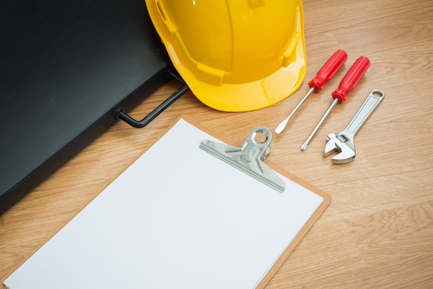 Yellow Safety Helmet Hat and clipboard