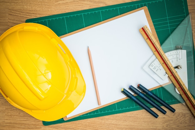 Yellow Safety Helmet Hat and clipboard