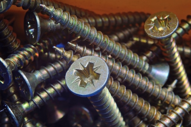 Yellow screws in a plastic box organizer