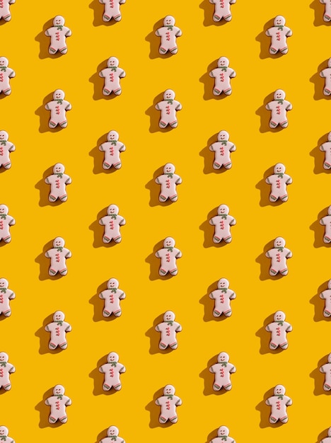 Yellow seamless background gingerbread man pattern