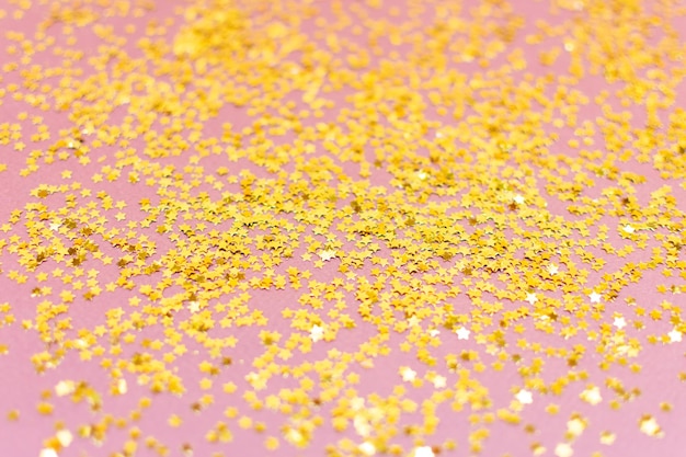 Yellow shiny stars on a brown background Star background