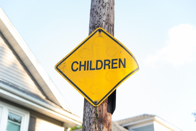 A yellow sign that says children children on it