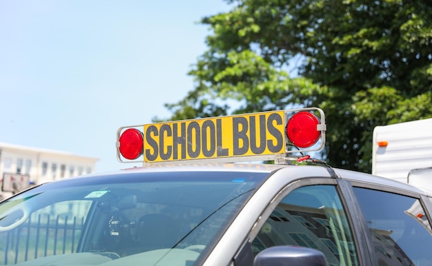 A yellow sign that says school bus school bus.