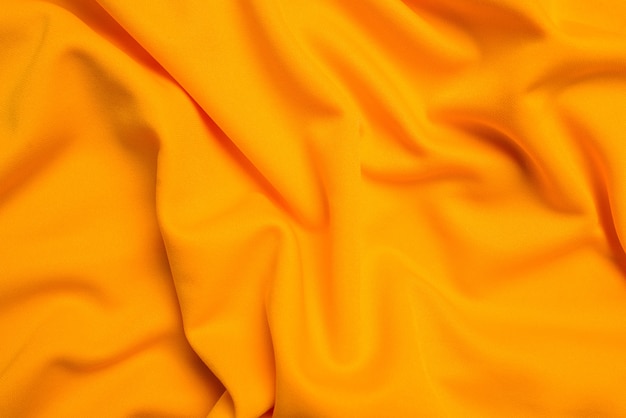 Yellow silk folded fabric background