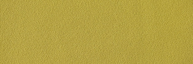 Yellow single color rough fabric background closeup of yellow textile