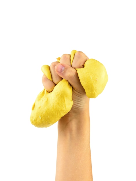 Yellow slime strongly squeezed by child's hand isolated. Toy antistress. Toy for the development of hand motor skills.