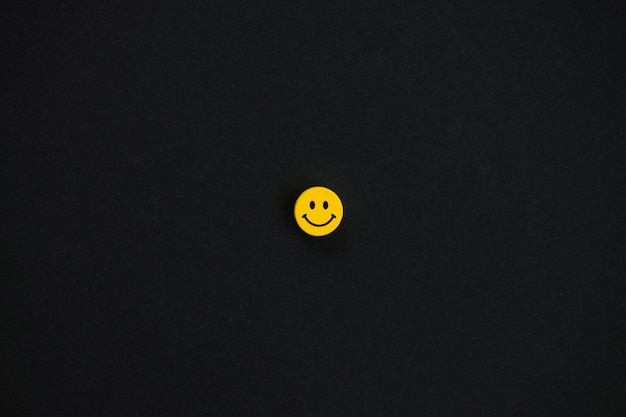 Yellow smile on black background