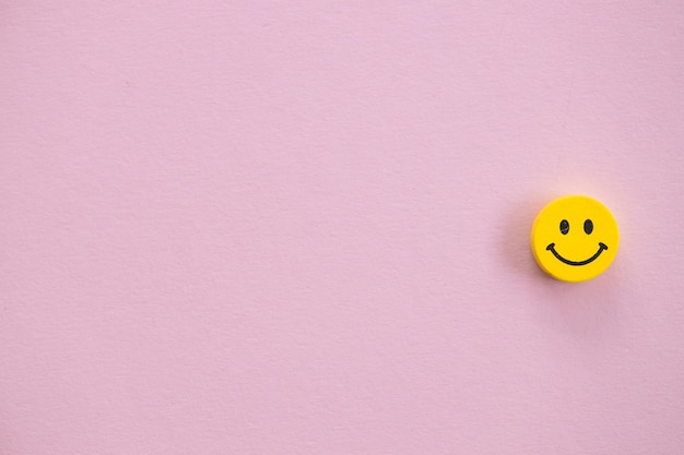 Yellow smile on pink background