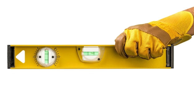 Yellow spirit level in workers hand isolated on white background.