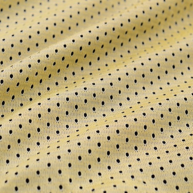 Yellow sport jersey clothing fabric texture and background with many folds