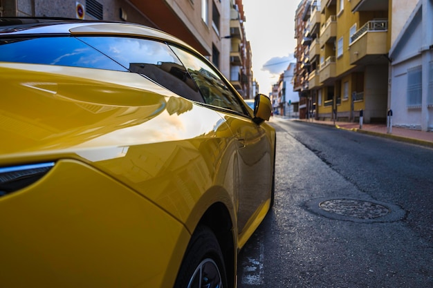 Photo yellow sports car parked on the street of the alicante