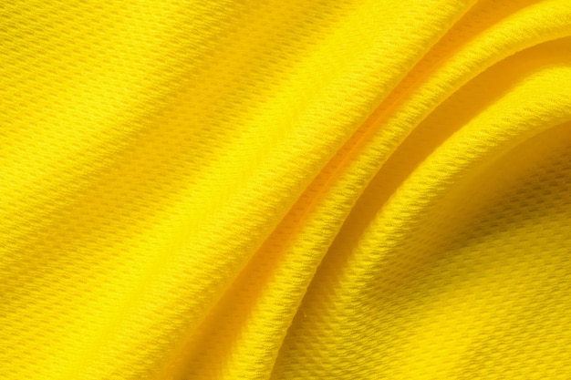 Yellow sports clothing fabric football shirt jersey texture close up