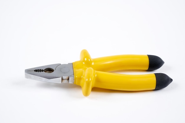 Yellow stainless steel pliers on an isolated white background.