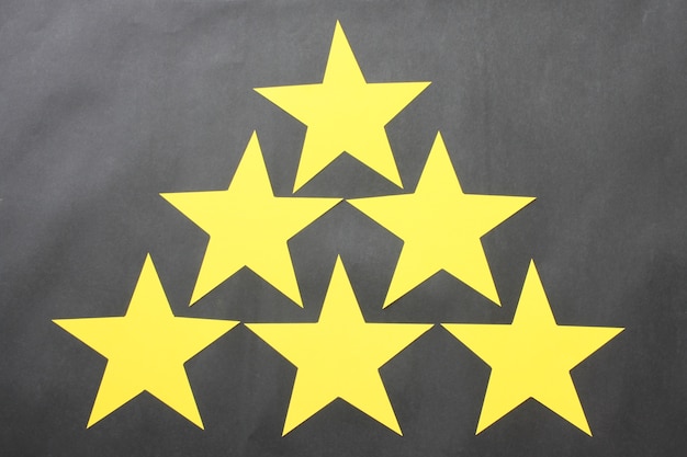 Yellow stars are placed on a black background for business ideas.