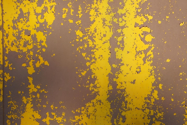 Yellow steel plate rough surface peeling paint showing rusty steel texture abstract background