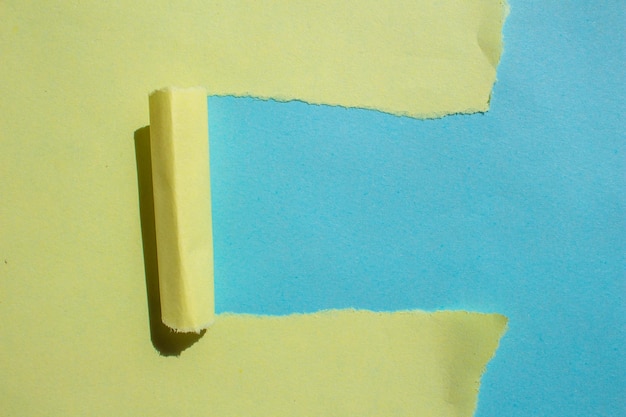 Yellow sticky tape on a blue background with the word " blue " on the top.